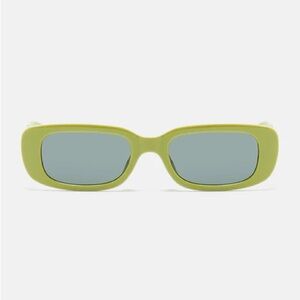 Woman’s Green Sunglasses